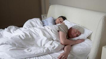 Nervous stressed woman pushes snoring husband try to fall asleep. Disturbed rest, obstructive apnea video