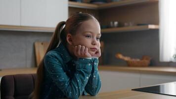 Frustrated unhappy pensive Caucasian sad upset child girl daughter kid at home kitchen alone offended stress thinking suffer disappoint lonely bad mood school failure unhealthy problem family trouble video