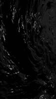 Rich black liquid texture vertical background depicting flowing waves of crude oil. Evokes themes of industry, energy and raw natural resources. Ideal for energy sector and environmental projects. video