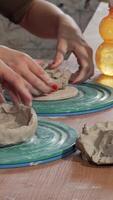 Talented potters passionately shaping clay bowls in a lively ceramics studio video