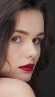 Enchanting profile of a stunning woman radiating elegance against a sleek black backdrop video
