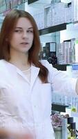 Pharmacist guiding customer in vibrant health product selection video
