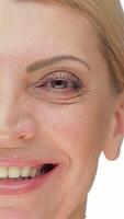 Radiant close-up portrait of a middle-aged woman with a warm smile video