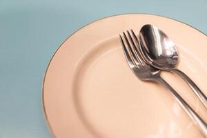 Elegant Place Setting with Spoon and Fork. a sense of dining, simplicity, and anticipation of a meal. Copy space. photo