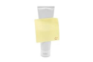 Minimal White Toothpaste Tube with Copy Space. White toothpaste tube with Sticky note for text. dental care, oral hygiene, beauty, cosmetic products, health, and personal care branding. photo