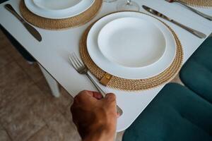 Experience elegant contemporary dining arrangements that enhance gatherings, showcasing hospitality with carefully selected utensils like forks, knives, and spoons to elevate your dining experience photo