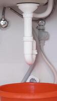 Vertical Close Up of Siphon with Visible Crack and Leak video