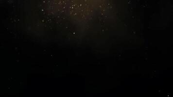 Golden Glitter Dust Falling in Slow Motion Against Black Background Creates an Elegant and Festive Atmosphere with Shimmer and Bokeh Effects video