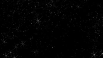 Sparkling Stars And Glitter Particles Floating On Black Background Creates A Magical And Festive Abstract Design For Celebrations And Glamorous Holiday Wallpaper video