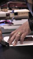A person cutting a piece of paper with a knife video