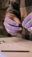 A person is working on a watch with a pair of scissors video