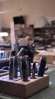 A work area with a variety of tools and a light video