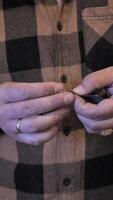 A man is holding a pair of scissors in his hands video
