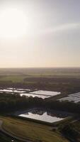 An aerial view of a large farm with water video