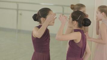 Two girls facing each other during warm-up video