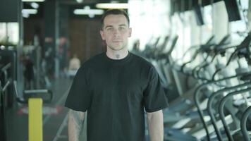 Man and woman doing fitness exercises in gym. Strength, endurance and training focus in modern fitness center 9 video