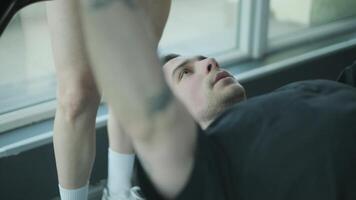 Man and woman doing fitness exercises in gym. Strength, endurance and training focus in modern fitness center 11 video
