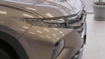 Car dealership with row of anonymous new vehicle on sale. Showroom with shiny auto. Automotive video