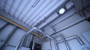 Modern industrial gas boiler room equipped for heating process. Heating gas boilers, pipelines, valves. 9 video