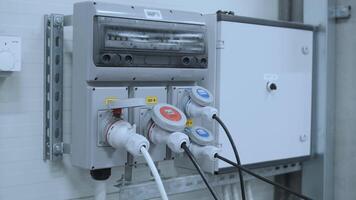 Industrial sockets and plug on distribution board. Factory site electricity 2 video