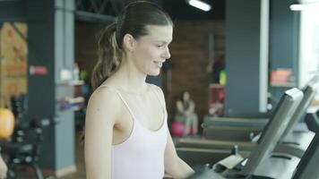 Man and woman doing fitness exercises in gym. Strength, endurance and training focus in modern fitness center 67 video