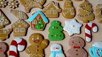 Set different colorful Gingerbread cookies with icing on table. Christmas food. Gingerbread man. Top view video