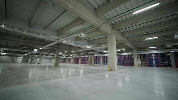Construction process of a big, modern warehouse with multiple garage gates for easy access and transportation of goods. video