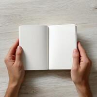 Hands holding a blank journal photo