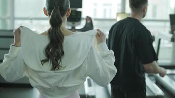 Man and woman doing fitness exercises in gym. Strength, endurance and training focus in modern fitness center 69 video