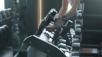 Man and woman doing fitness exercises in gym. Strength, endurance and training focus in modern fitness center 51 video