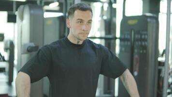 Man and woman doing fitness exercises in gym. Strength, endurance and training focus in modern fitness center 24 video