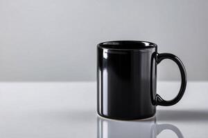 Black Mug Shadow Set Against Clean White Backdrop photo