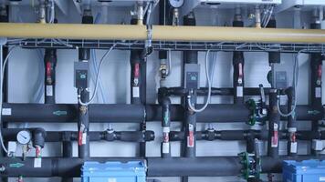 Modern industrial gas boiler room equipped for heating process. Heating gas boilers, pipelines, valves. 5 video