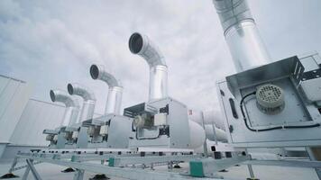 The air conditioning and ventilation system of a large industrial facility is located on the roof. It includes an air conditioner, smoke exhaust, and ventilation. 4 video