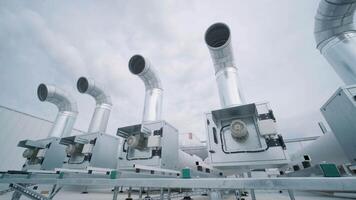 The air conditioning and ventilation system of a large industrial facility is located on the roof. It includes an air conditioner, smoke exhaust, and ventilation. 5 video