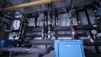 Modern industrial gas boiler room equipped for heating process. Heating gas boilers, pipelines, valves. video