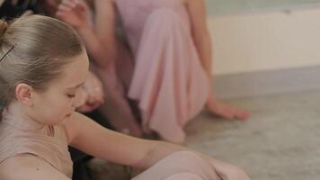 Ballet teacher guiding young students video