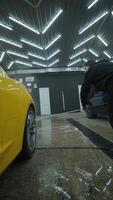 Rear Side View of Yellow Vehicle at Car Wash Station video