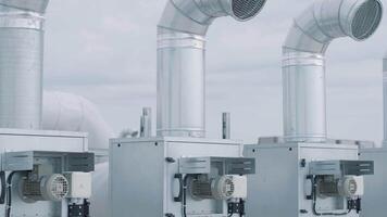 The air conditioning and ventilation system of a large industrial facility is located on the roof. It includes an air conditioner, smoke exhaust, and ventilation. 16 video