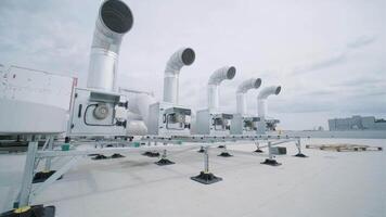 The air conditioning and ventilation system of a large industrial facility is located on the roof. It includes an air conditioner, smoke exhaust, and ventilation. video