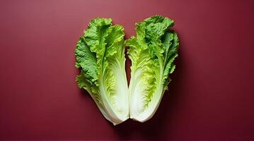 Fresh Bok Choy Halves Against a Deep Burgundy Background photo