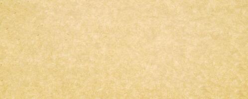 A brown paper texture background with a few small spots photo