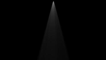 A spotlight is shining on a black background video