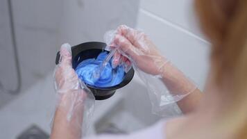 Mixing vibrant blue hair color for a bold transformation video