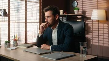 Pensive thinking sad stressed overworked business work online problem close laptop burnout nervous working middle-aged Caucasian man businessman worker male guy in office annoyed think problem decide photo