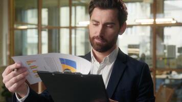 Business man Caucasian thoughtful male businessman reading document contract in office bank employee sign insurance successful deal smiling happy middle-aged guy contractor manager consider project photo
