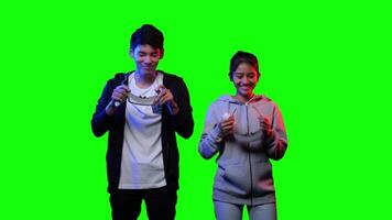 Excited young couple preparing to experience virtual reality with VR headset on green screen background. video