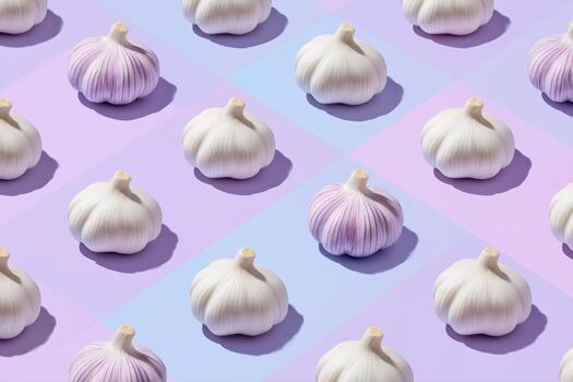 Bulbs of garlic on a colored background, colorful garlic pattern photo