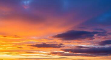 colorful sunset sky panorama with pink orange and yellow clouds photo