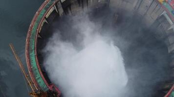 Aerial view of biggest hydro electric power plant with white smoky mist clouds video